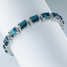 Rannekoru timanttikoru ja topaasin kanssa