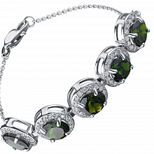 Valkokultainen rannekoru joissa on kromidiopsideja ja timanttikoru