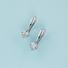 Valkokultainen korvakoru timanttikoru