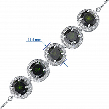 Valkokultainen rannekoru joissa on kromidiopsideja ja timanttikoru