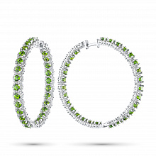 Valkokultainen korvakoru timanttikoru ja joissa on kromidiopsideja